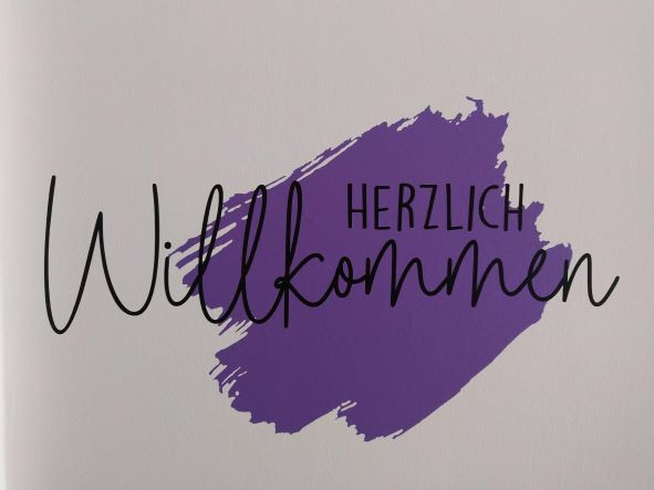 Herzlich Willkommen Schriftzug